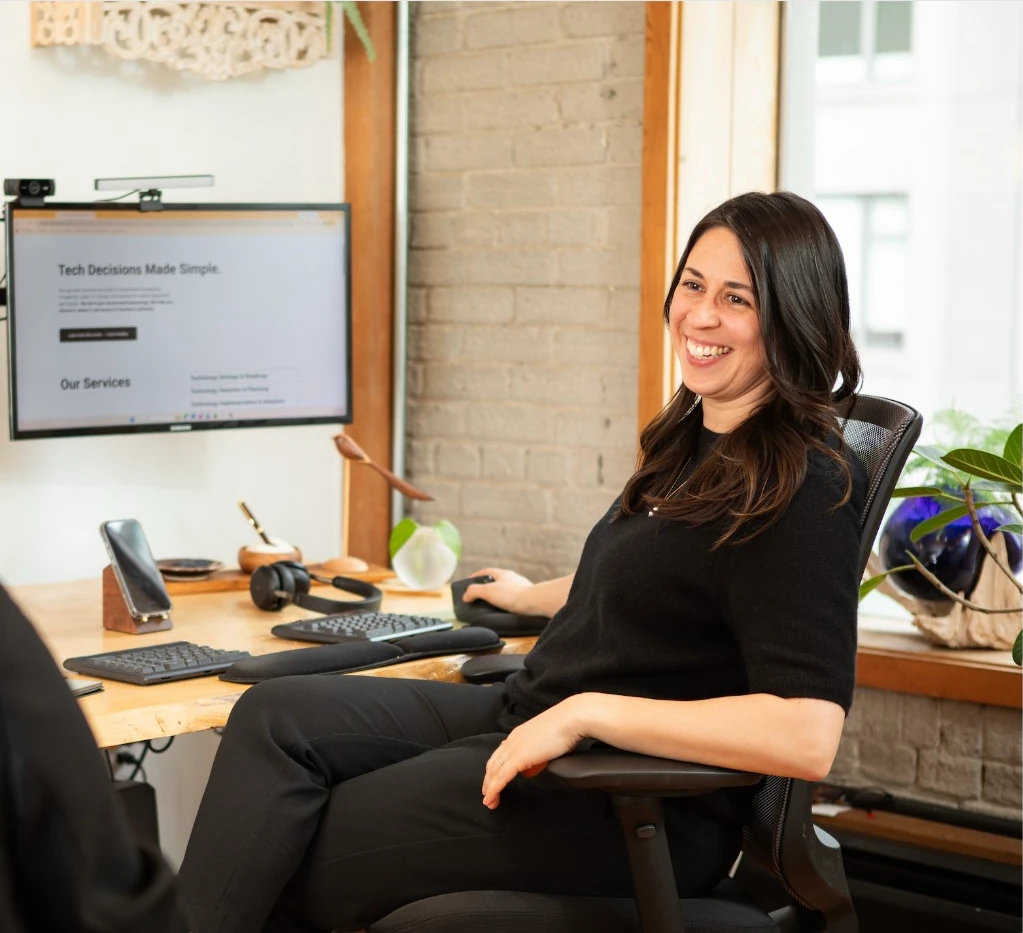 Meira consultant working at a desk with technology